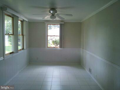 3116 Sollers Point Road Baltimore, MD 21222 - Photo 5 of 8 an empty room with a window