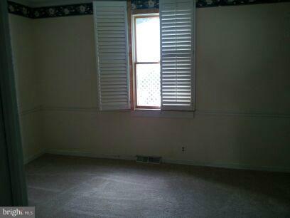 3116 Sollers Point Road Baltimore, MD 21222 - Photo 6 of 8 a view of a room that has a window in it