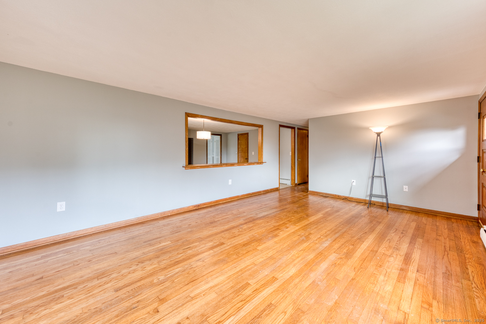 26 Edgarton Road Columbia, CT 06237 - Photo 13 of 35 a view of an empty room with wooden floor and a window