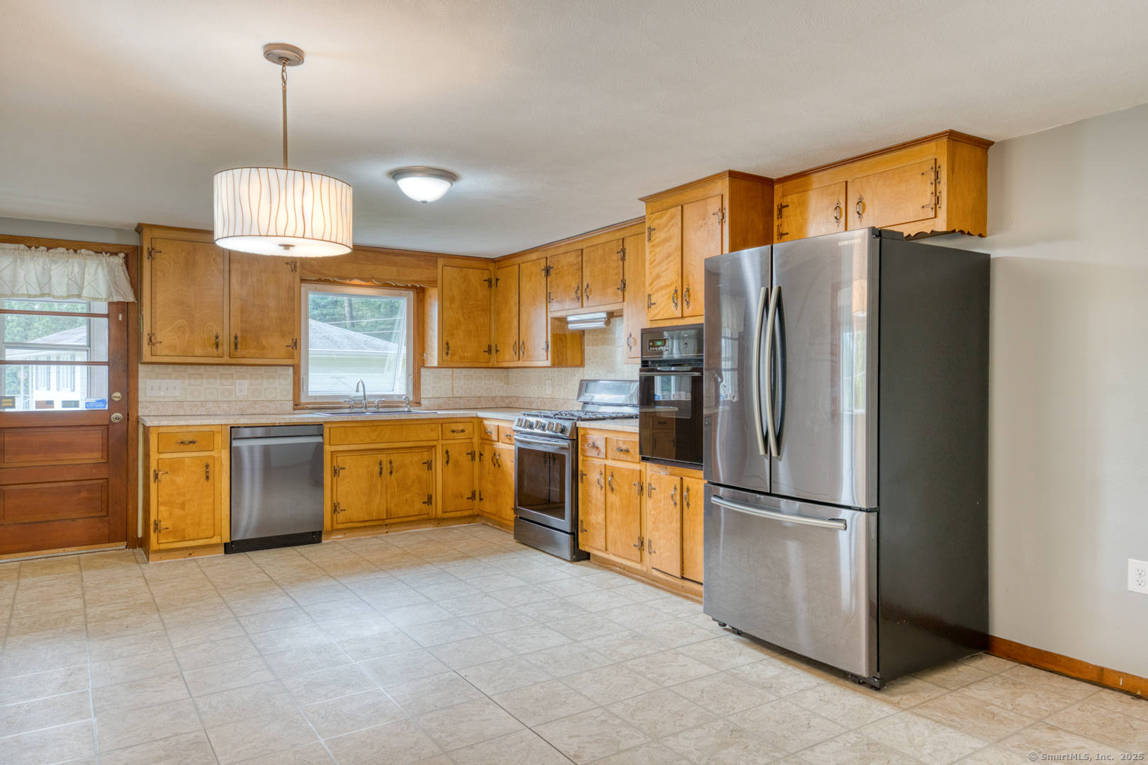 26 Edgarton Road Columbia, CT 06237 - Photo 15 of 35 a kitchen with granite countertop a refrigerator a sink a stove and island
