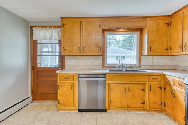 a view of a kitchen with a sink cabinets and a living room
