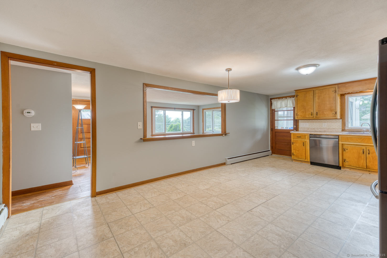 26 Edgarton Road Columbia, CT 06237 - Photo 18 of 35 a view of a kitchen with a sink cabinets and a living room