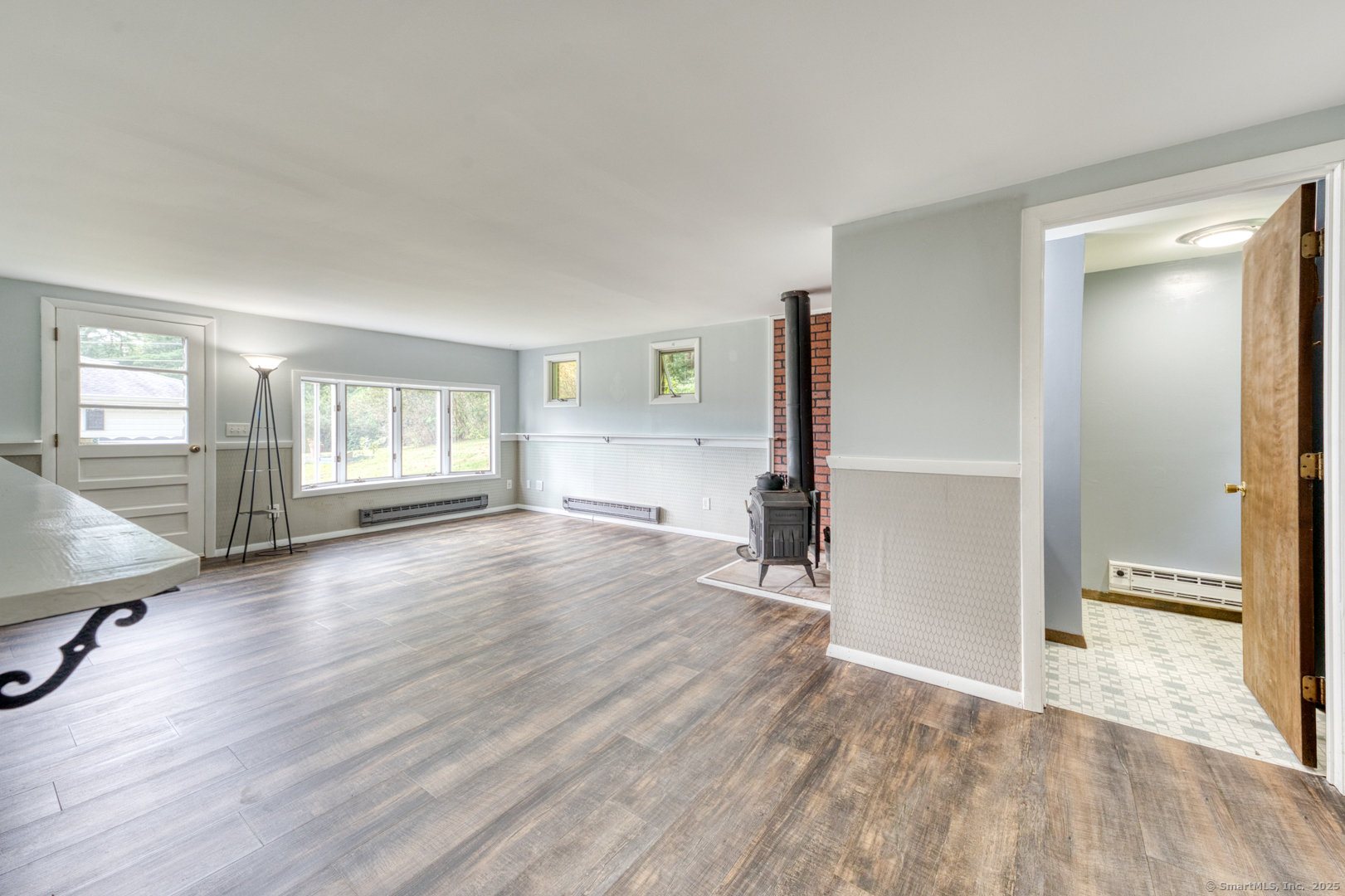 26 Edgarton Road Columbia, CT 06237 - Photo 19 of 35 an empty room with wooden floor and windows