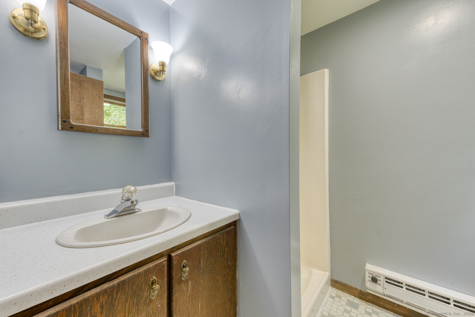 26 Edgarton Road Columbia, CT 06237 - Photo 23 of 35 a bathroom with a sink and a mirror