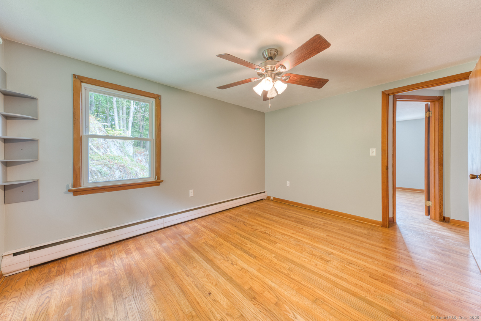 26 Edgarton Road Columbia, CT 06237 - Photo 30 of 35 a view of an empty room with wooden floor and a window