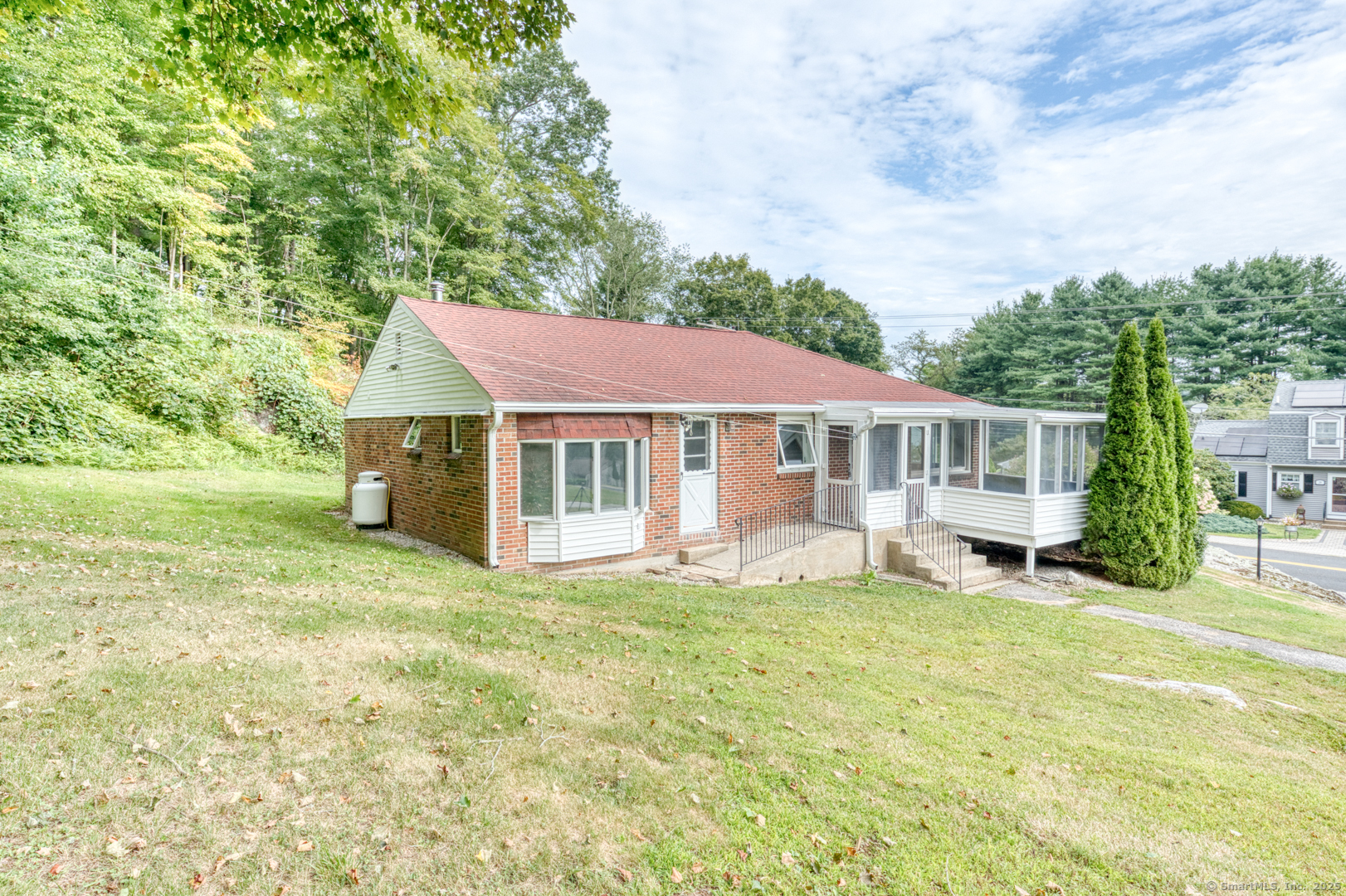 26 Edgarton Road Columbia, CT 06237 - Photo 3 of 35 a front view of a house with a garden