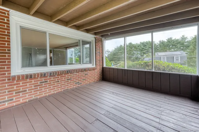 a view of outdoor space with wooden floor and outdoor seating