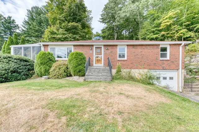 front view of a house with a yard