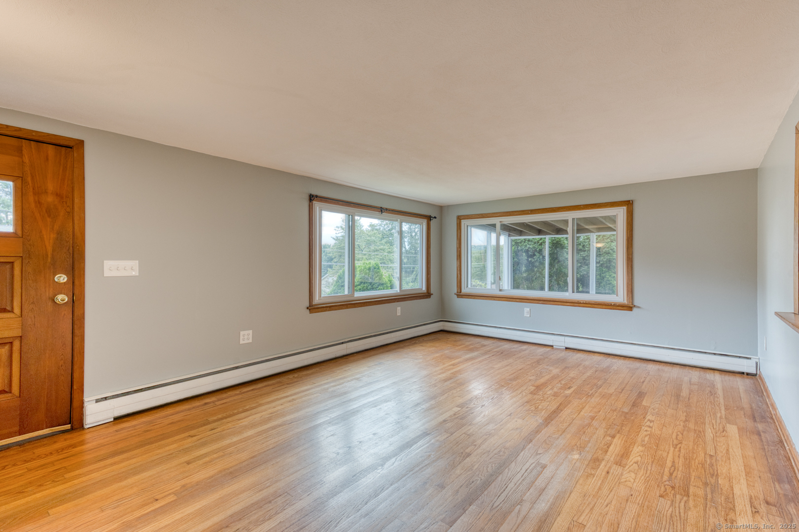 26 Edgarton Road Columbia, CT 06237 - Photo 10 of 35 a view of an empty room with wooden floor and a window