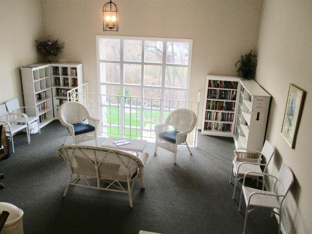 5548 Spring Brook Road, Unit G1 Rockford, IL 61114 - Photo 3 of 15 a living room with furniture and a window