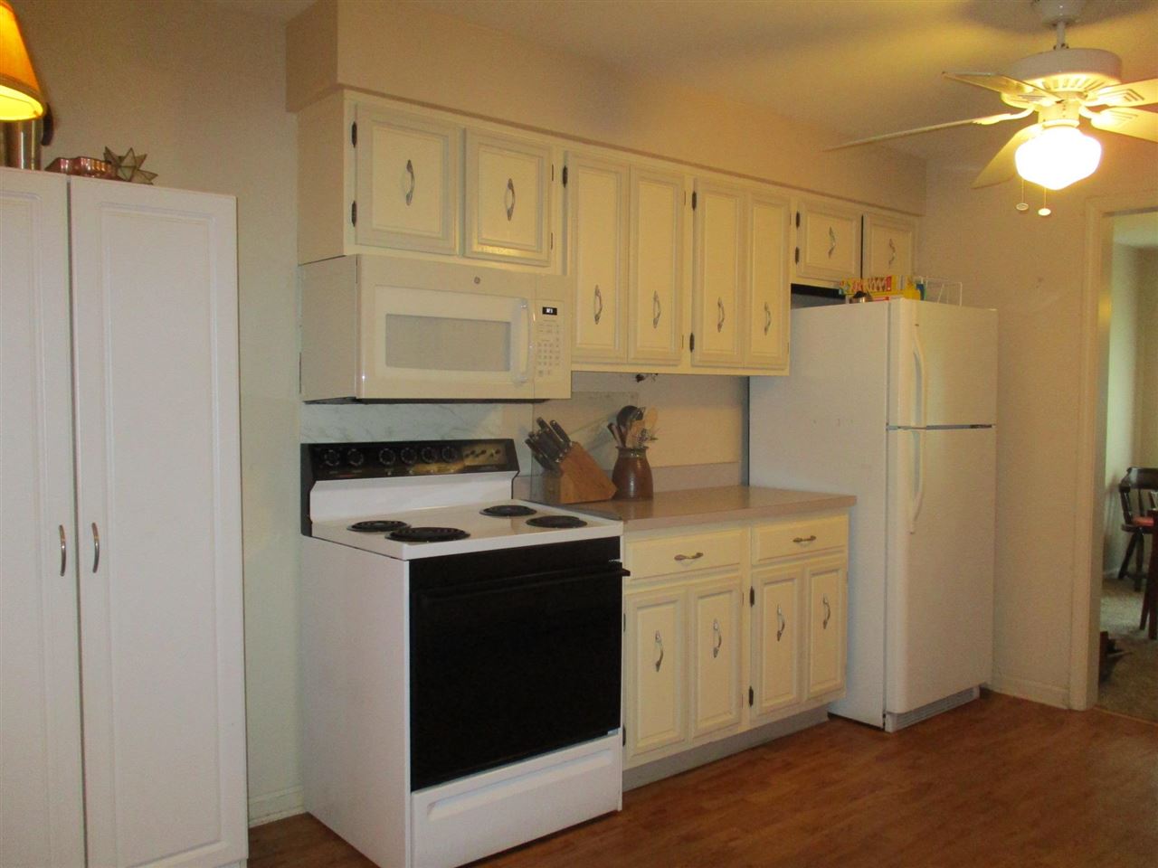 5548 Spring Brook Road, Unit G1 Rockford, IL 61114 - Photo 7 of 15 a kitchen with stainless steel appliances a stove a refrigerator and cabinets