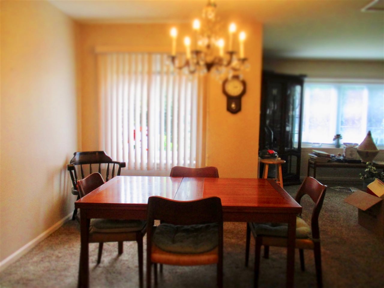5548 Spring Brook Road, Unit G1 Rockford, IL 61114 - Photo 9 of 15 a view of a dining room with furniture and a window
