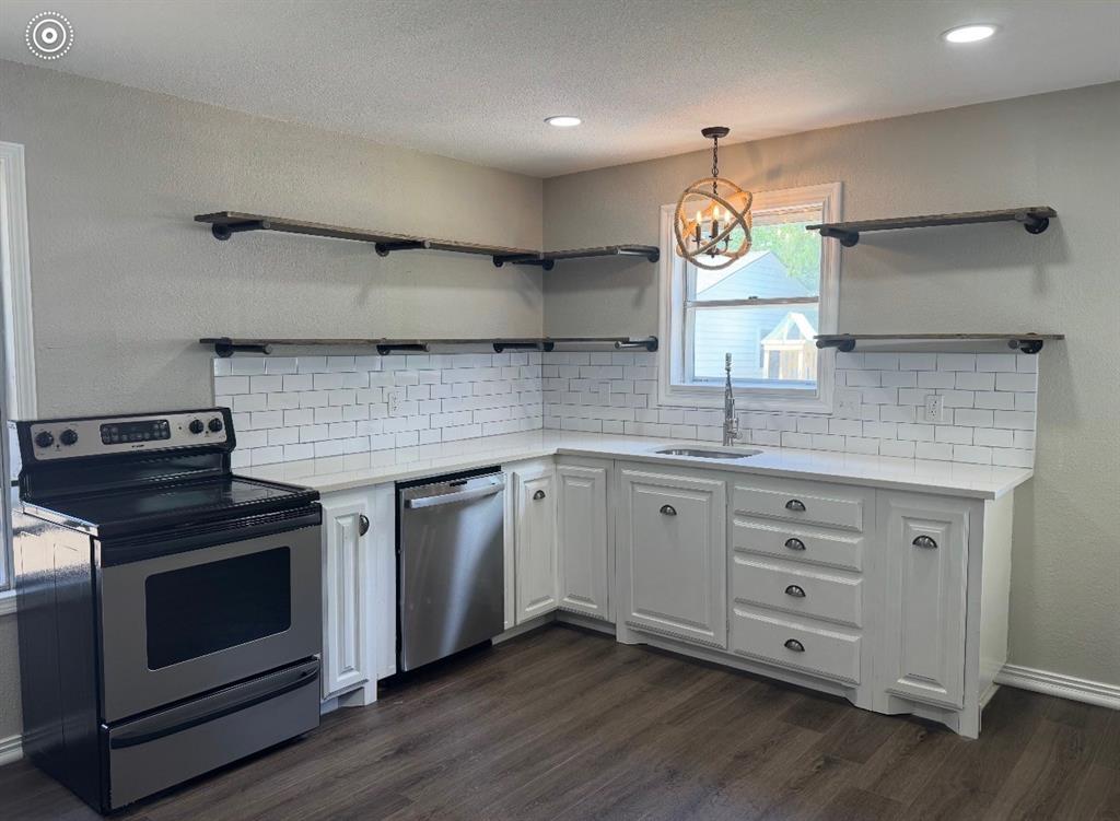 440 Rigsby Street Van Alstyne, TX 75495 - Photo 4 of 7 Kitchen featuring white shaker-style cabinetry, a stainless steel electric range, a stainless steel dishwasher, and a white subway tile backsplash