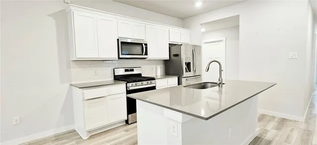 a view of a kitchen with a sink