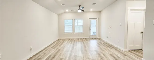 a kitchen with stainless steel appliances a microwave a sink and a refrigerator