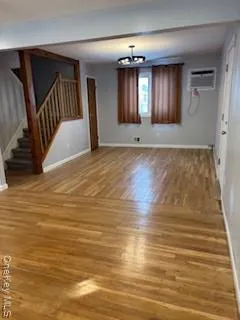 a kitchen with stainless steel appliances granite countertop a sink a stove and a microwave oven