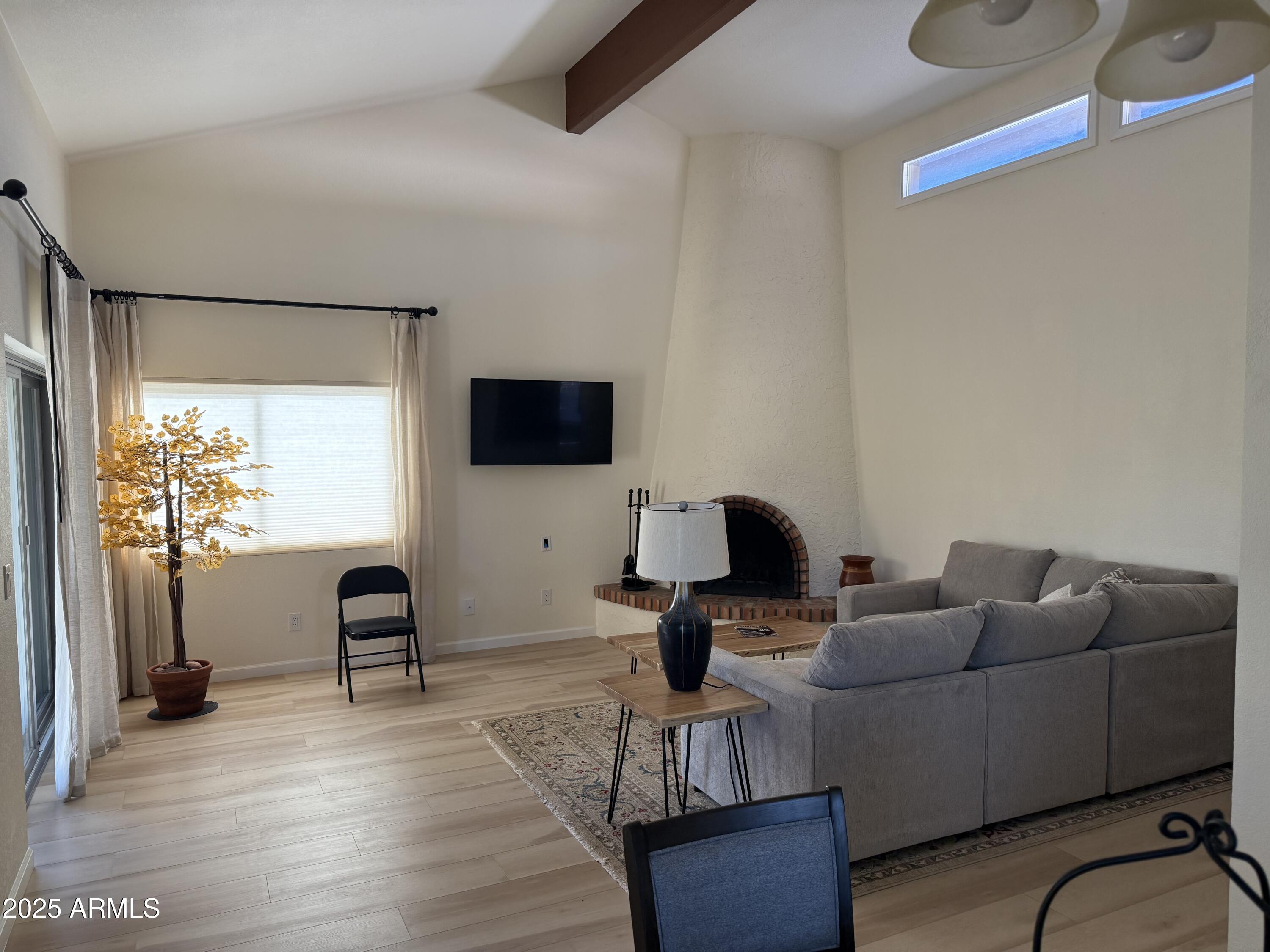 18560 East Horseshoe Bend Rio Verde, AZ 85263 - Photo 11 of 42 a living room with furniture and a flat screen tv