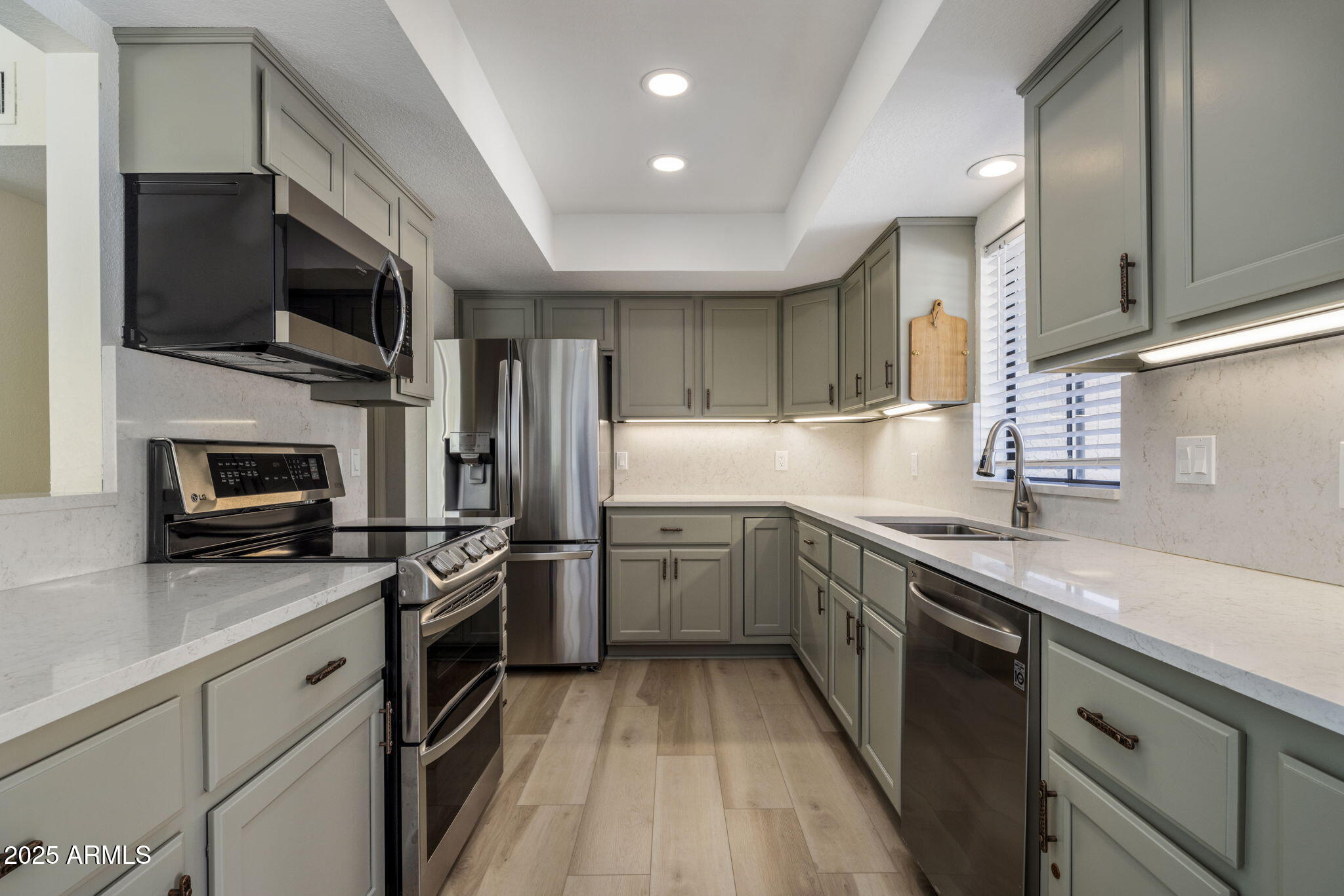 18560 East Horseshoe Bend Rio Verde, AZ 85263 - Photo 14 of 42 a kitchen with a sink stainless steel appliances and cabinets