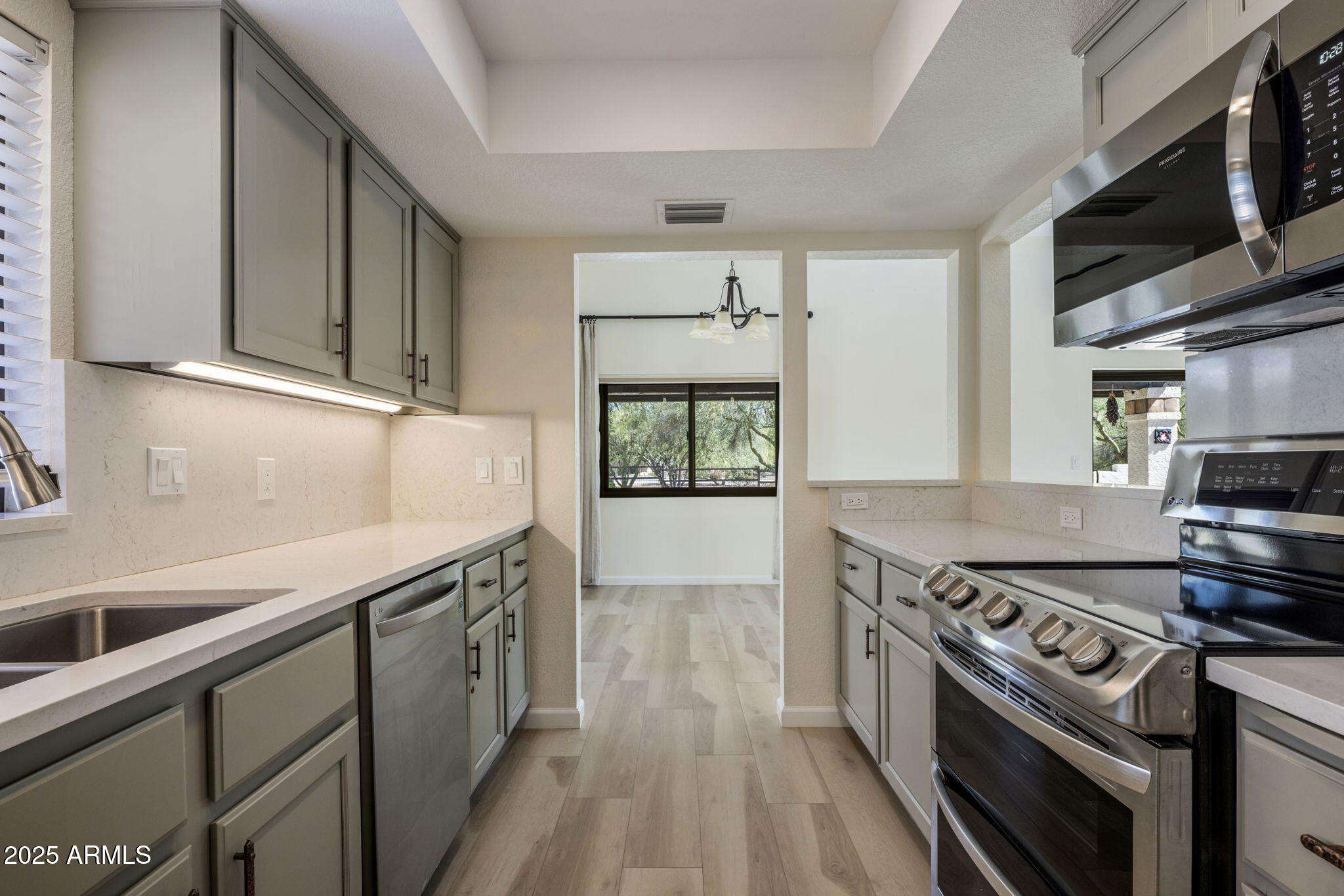 18560 East Horseshoe Bend Rio Verde, AZ 85263 - Photo 15 of 42 a kitchen with a stove and a sink