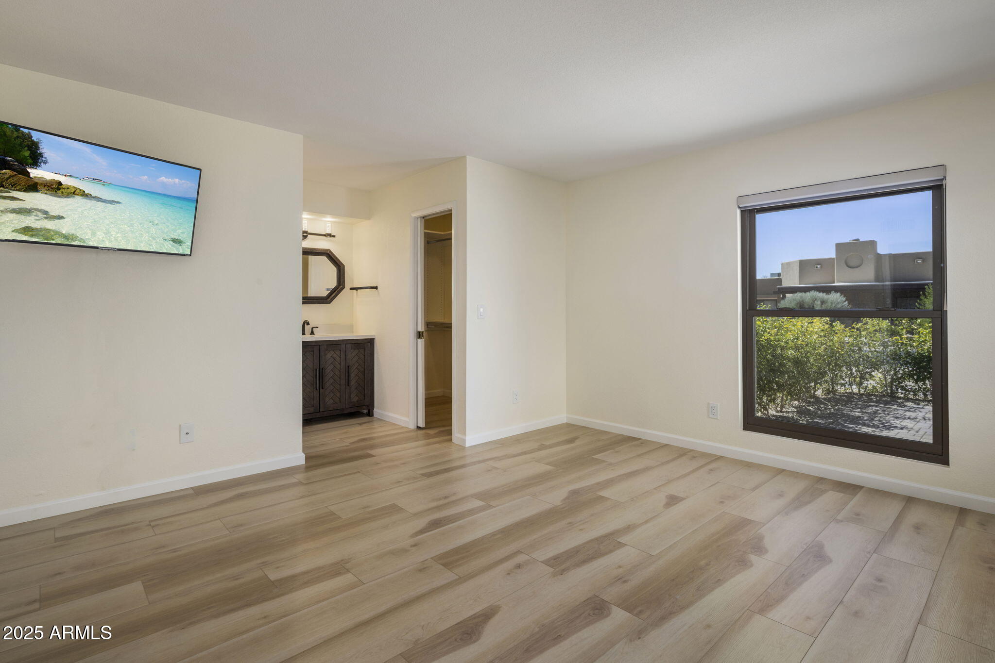 18560 East Horseshoe Bend Rio Verde, AZ 85263 - Photo 19 of 42 a view of an empty room with a window and wooden floor