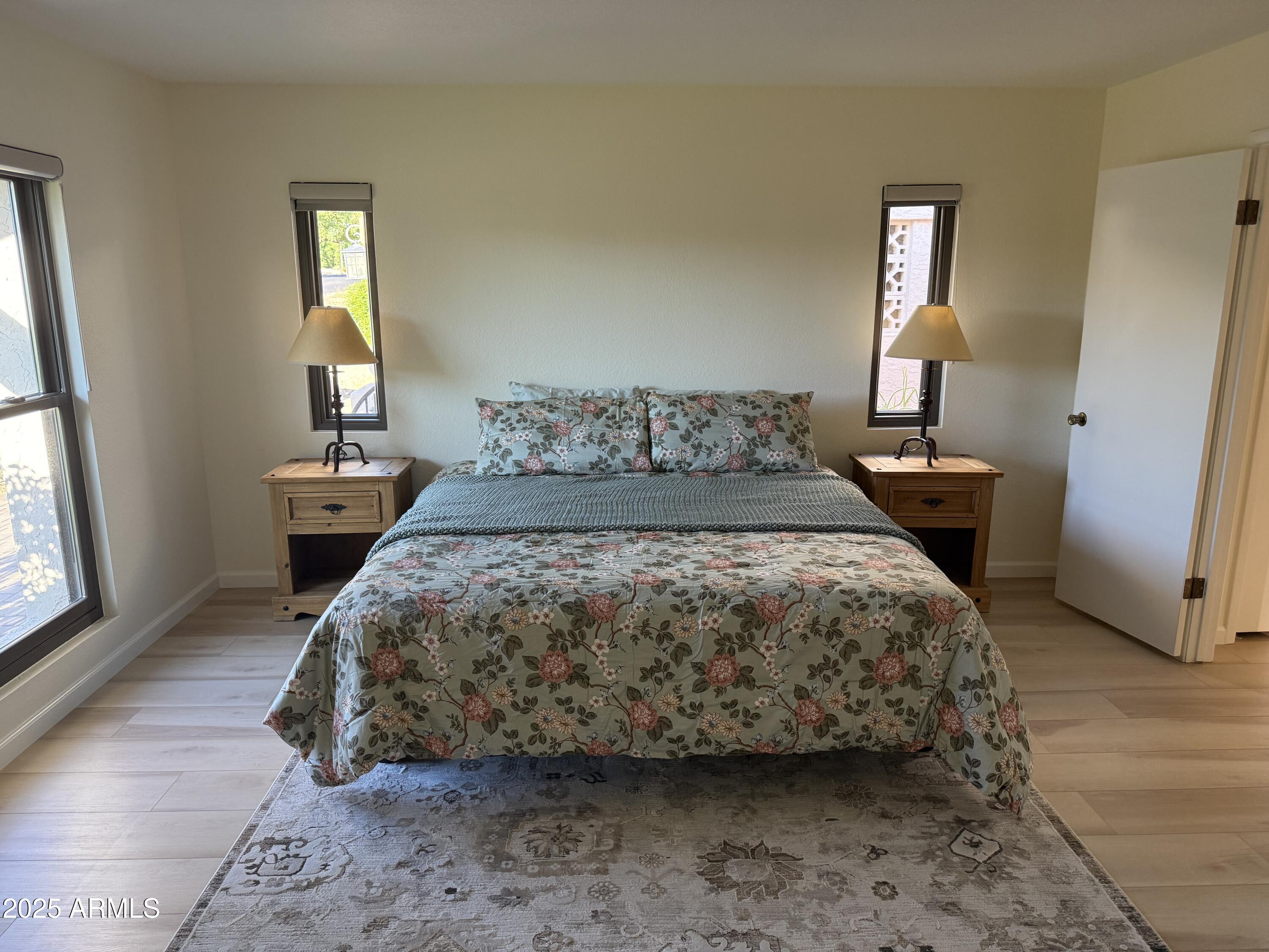 18560 East Horseshoe Bend Rio Verde, AZ 85263 - Photo 20 of 42 a bedroom with a bed and wooden floor