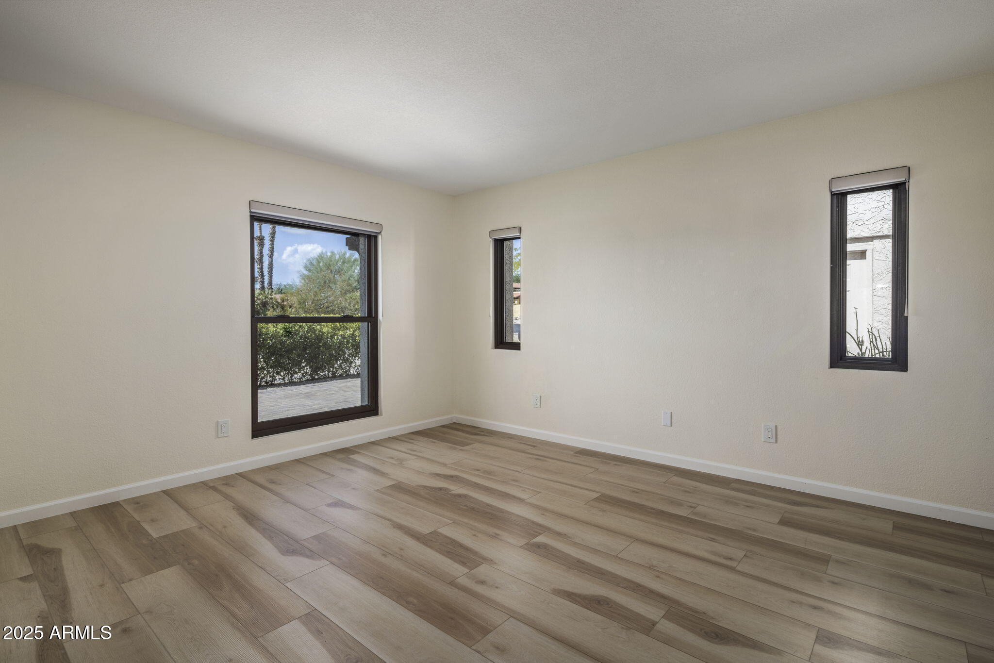 18560 East Horseshoe Bend Rio Verde, AZ 85263 - Photo 21 of 42 a view of an empty room with wooden floor and a window