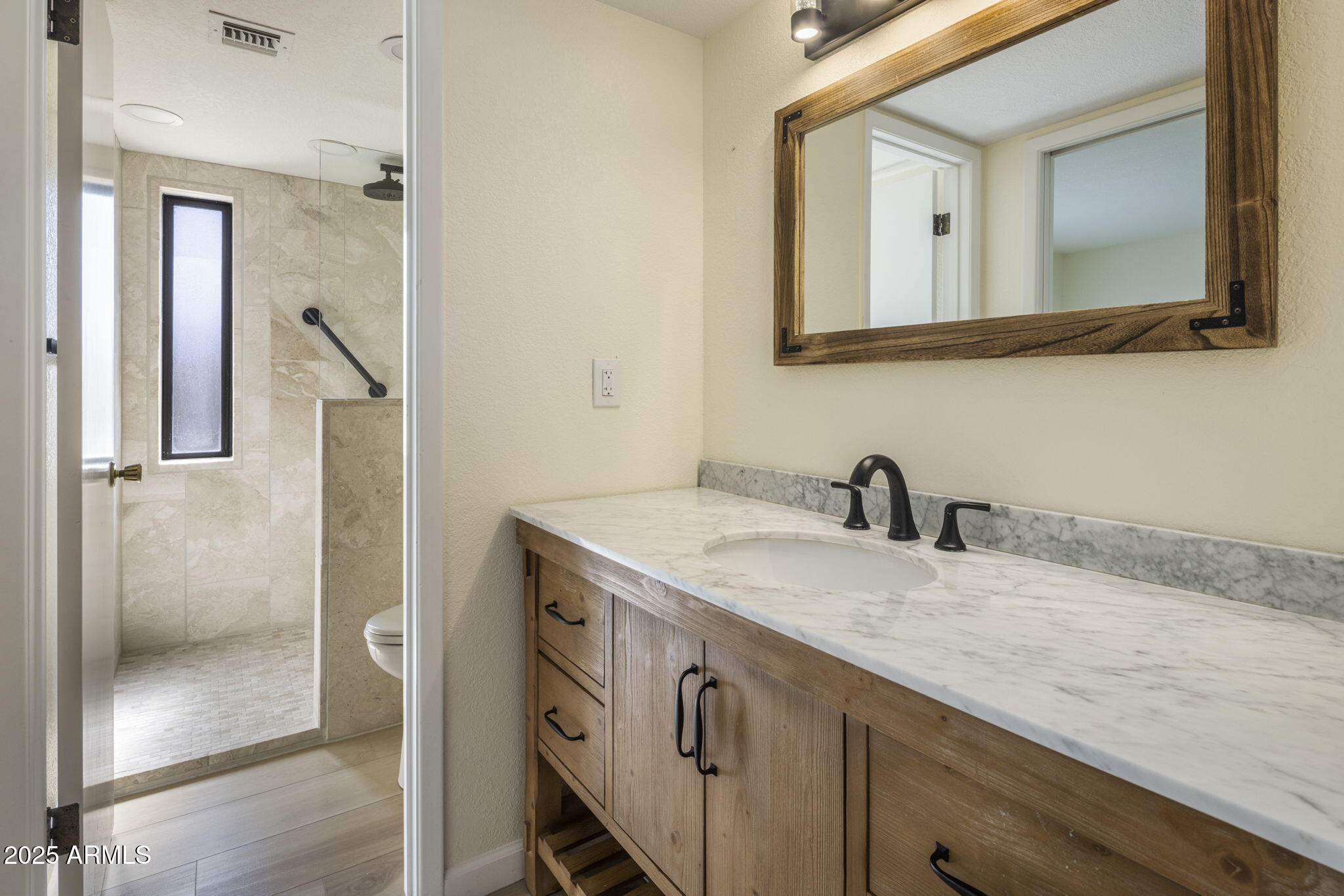 18560 East Horseshoe Bend Rio Verde, AZ 85263 - Photo 22 of 42 a bathroom with a granite countertop sink and a mirror