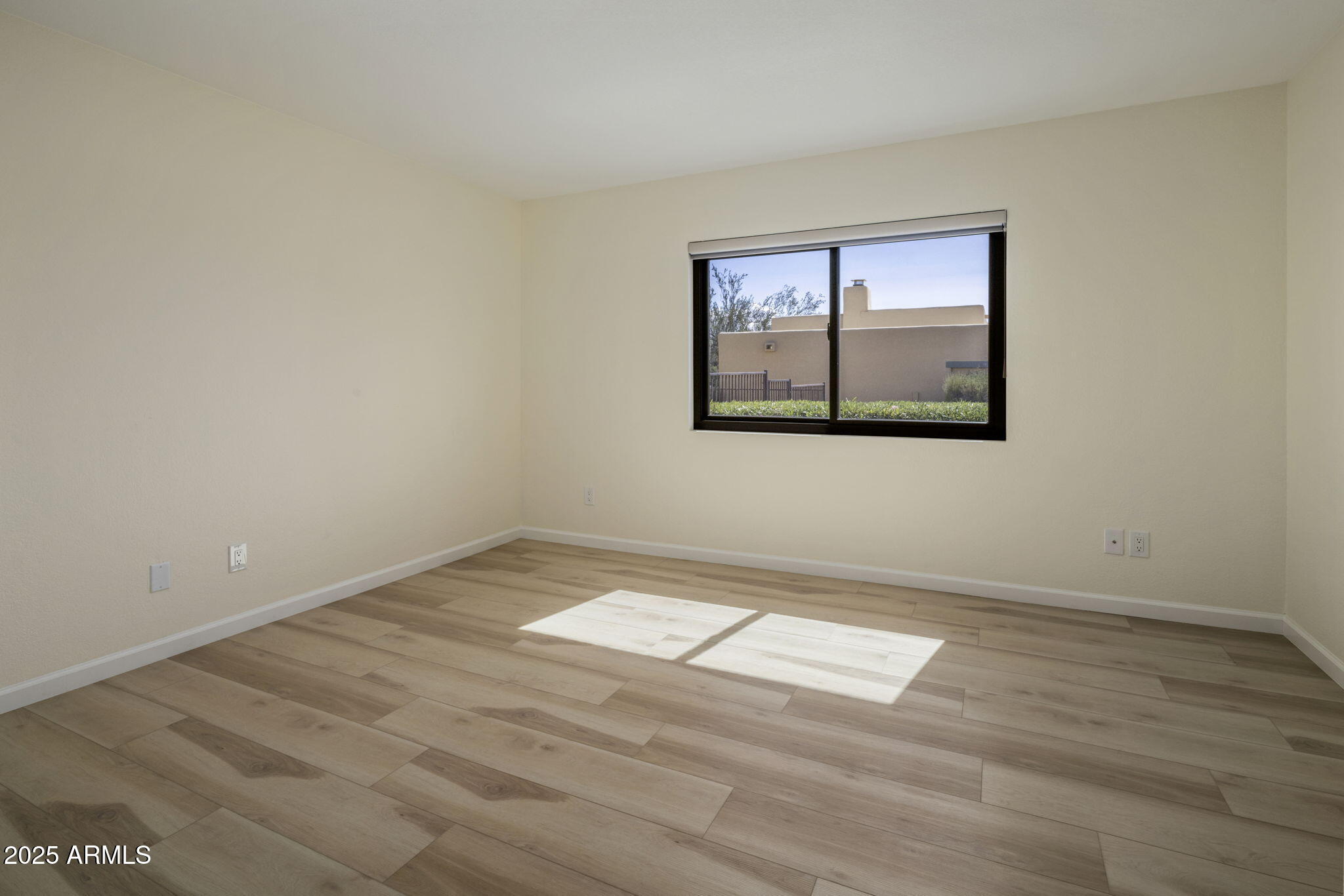 18560 East Horseshoe Bend Rio Verde, AZ 85263 - Photo 26 of 42 an empty room with wooden floor and windows
