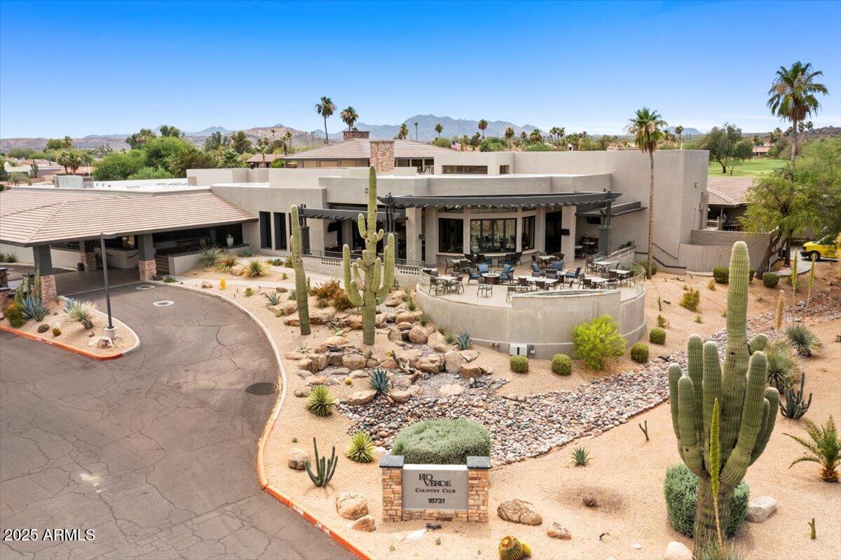 18560 East Horseshoe Bend Rio Verde, AZ 85263 - Photo 38 of 42 a view of a white house with swimming pool and sitting area