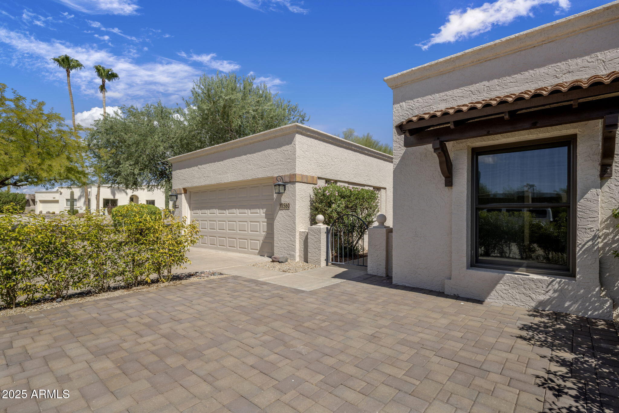 18560 East Horseshoe Bend Rio Verde, AZ 85263 - Photo 5 of 42 a front view of a house with a yard and garage