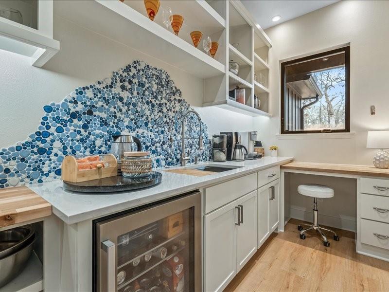 8701 Zebra Crossing Larue, TX 75770 - Photo 11 of 39 Desk to create menus or pay bills. Artistic flair above large sink and water fixture in pantry.
