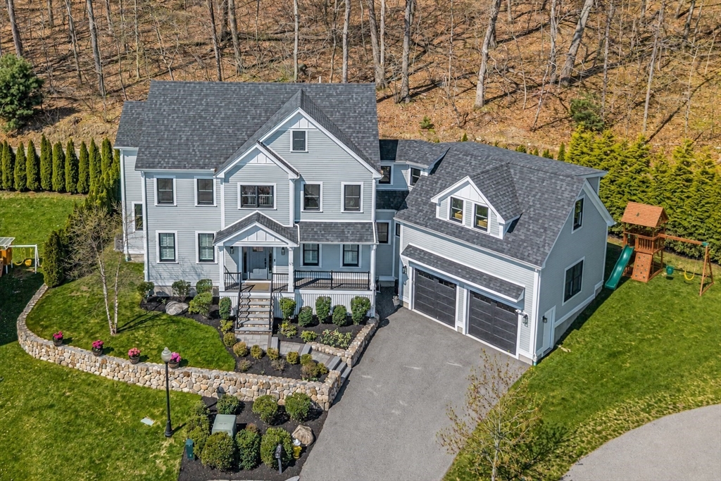 17 Sunrise Terrace Needham, MA 02492 - Photo 41 of 42 a front view of a house with a yard and potted plants