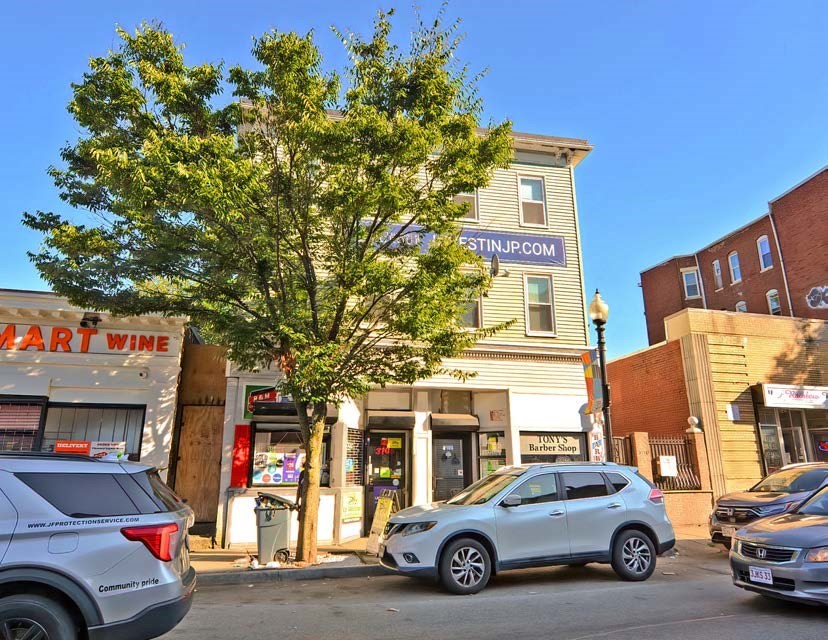 3106-3110 Washington Street Boston, MA 02119 - Photo 3 of 16 a view of a cars park in front of a building