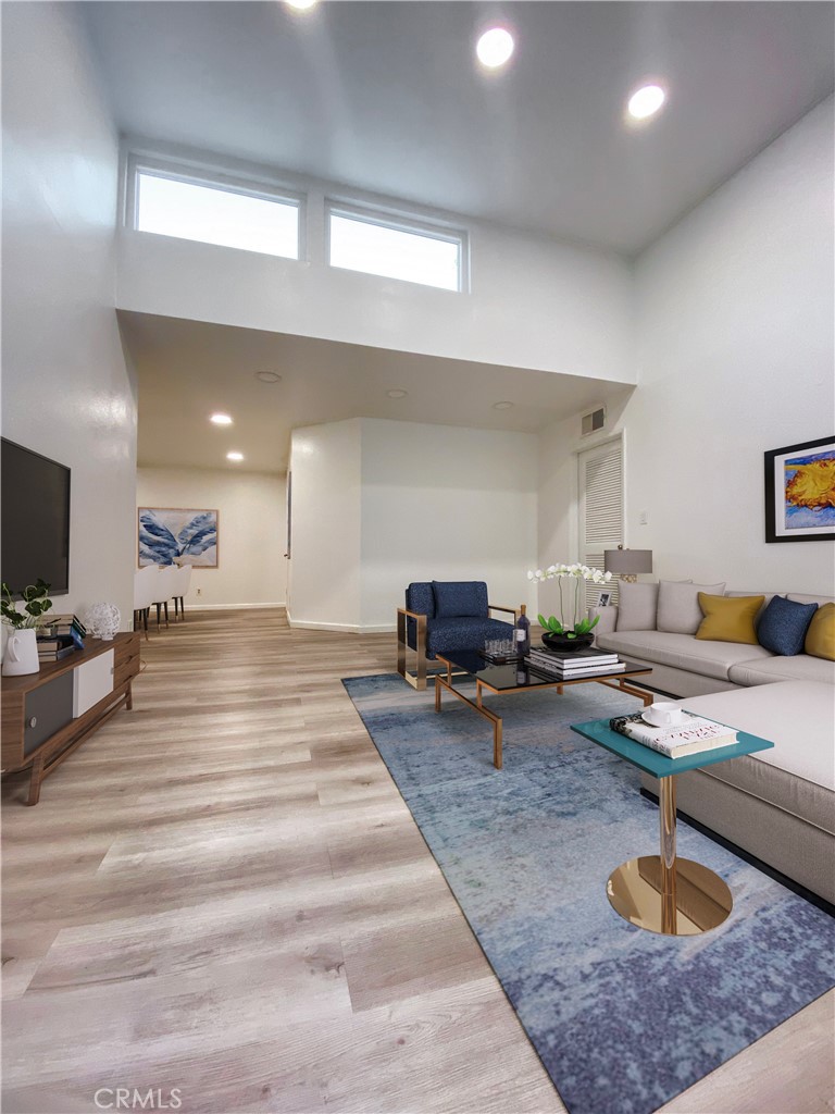 18645 Hatteras Street, Unit 278 Tarzana, CA 91356 - Photo 1 of 37 a living room with furniture and a couch