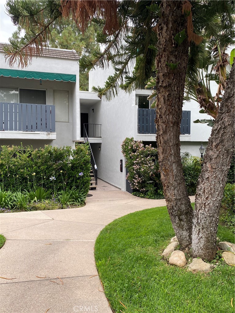 18645 Hatteras Street, Unit 278 Tarzana, CA 91356 - Photo 20 of 37 a front view of a house with a yard