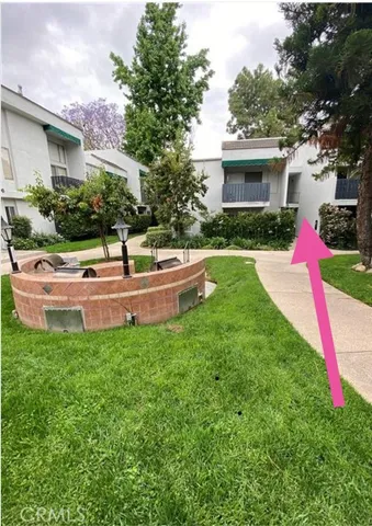 a front view of house with yard and trees
