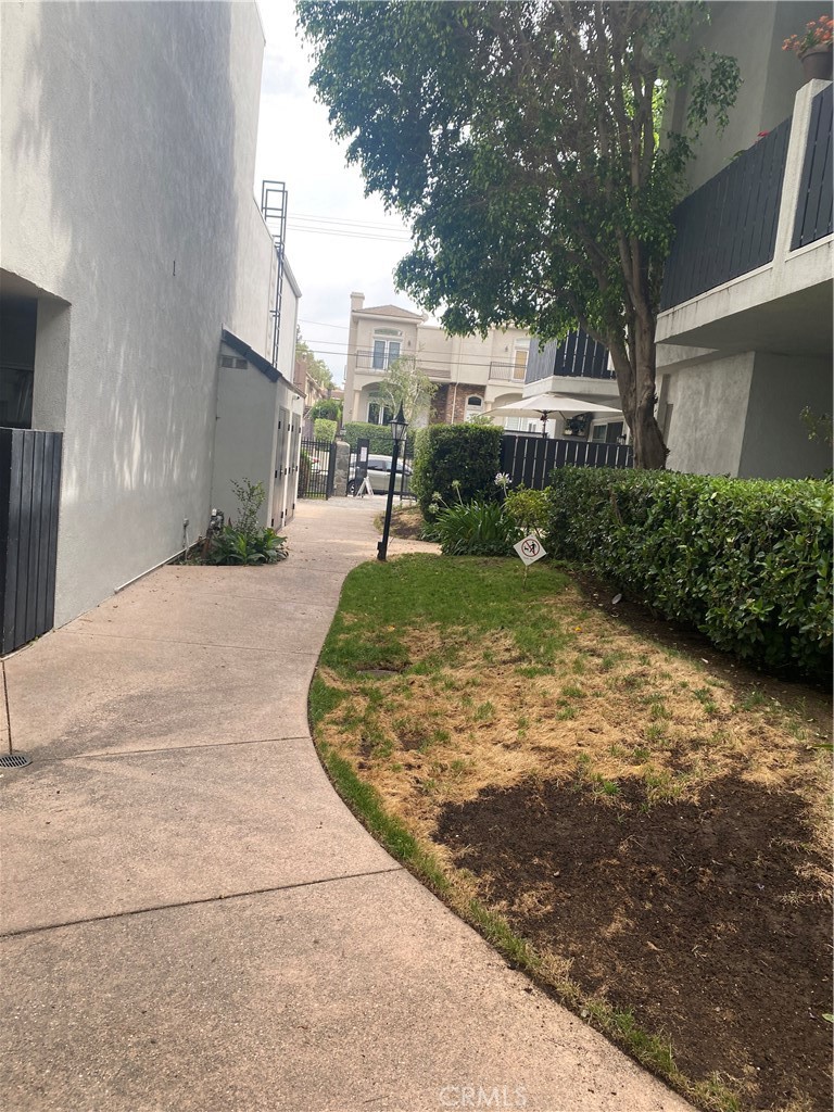 18645 Hatteras Street, Unit 278 Tarzana, CA 91356 - Photo 23 of 37 a view of a street with houses