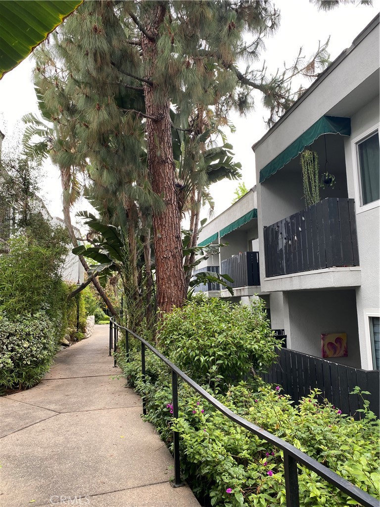 18645 Hatteras Street, Unit 278 Tarzana, CA 91356 - Photo 25 of 37 a front view of a house with a yard