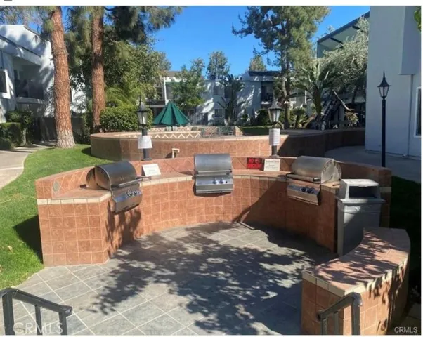a view of a backyard with sitting area
