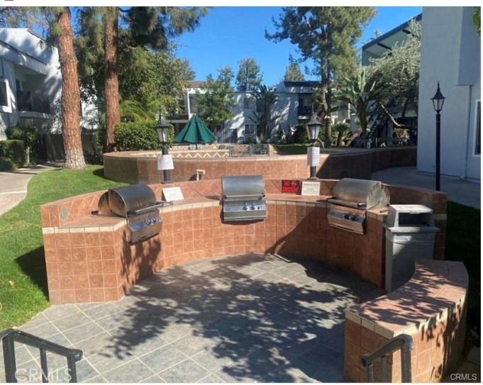 18645 Hatteras Street, Unit 278 Tarzana, CA 91356 - Photo 28 of 37 a view of a backyard with sitting area