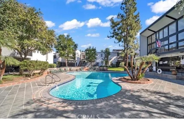 a view of a swimming pool with a sitting area