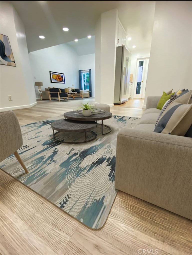 18645 Hatteras Street, Unit 278 Tarzana, CA 91356 - Photo 3 of 37 a living room with furniture and a flat screen tv