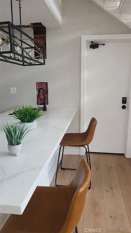 a balcony with table and chairs