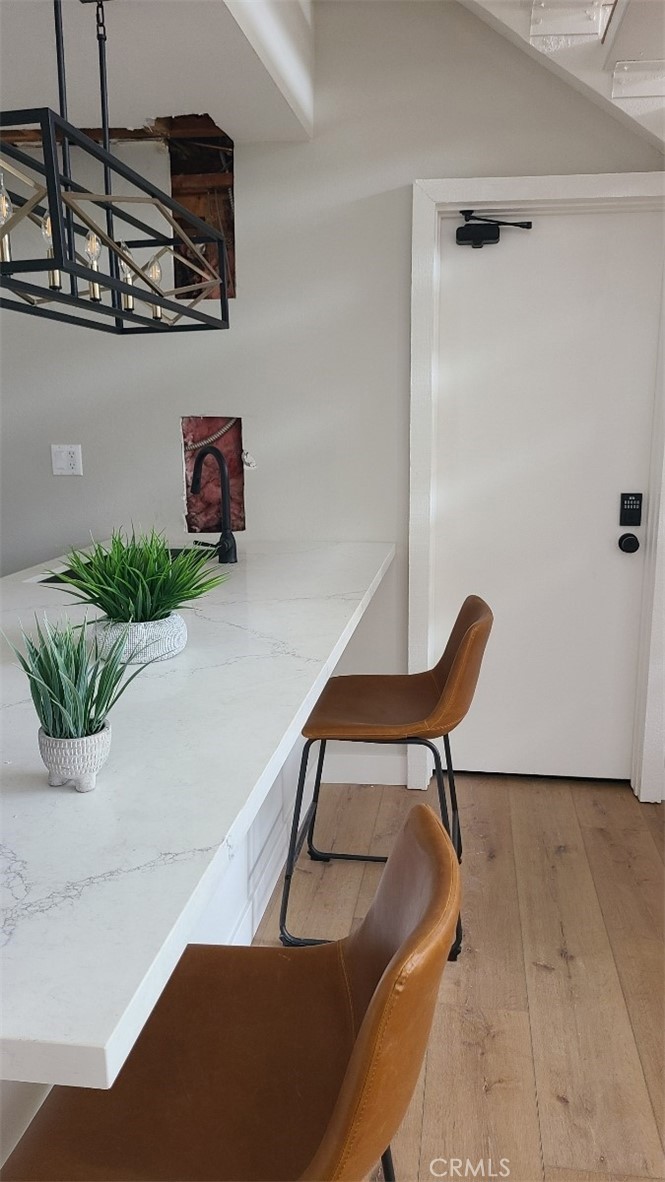 18645 Hatteras Street, Unit 278 Tarzana, CA 91356 - Photo 32 of 37 a balcony with table and chairs