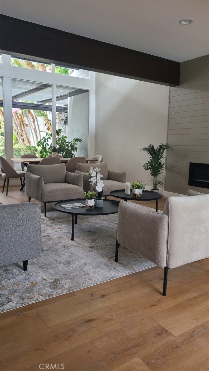 18645 Hatteras Street, Unit 278 Tarzana, CA 91356 - Photo 33 of 37 a living room with furniture and a potted plant