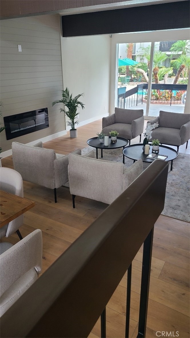 18645 Hatteras Street, Unit 278 Tarzana, CA 91356 - Photo 35 of 37 a living room with furniture and large windows