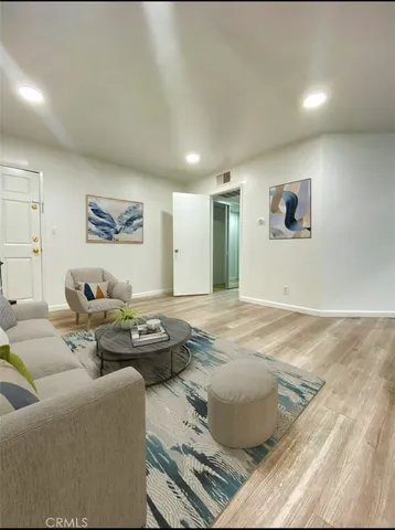 a living room with furniture and window