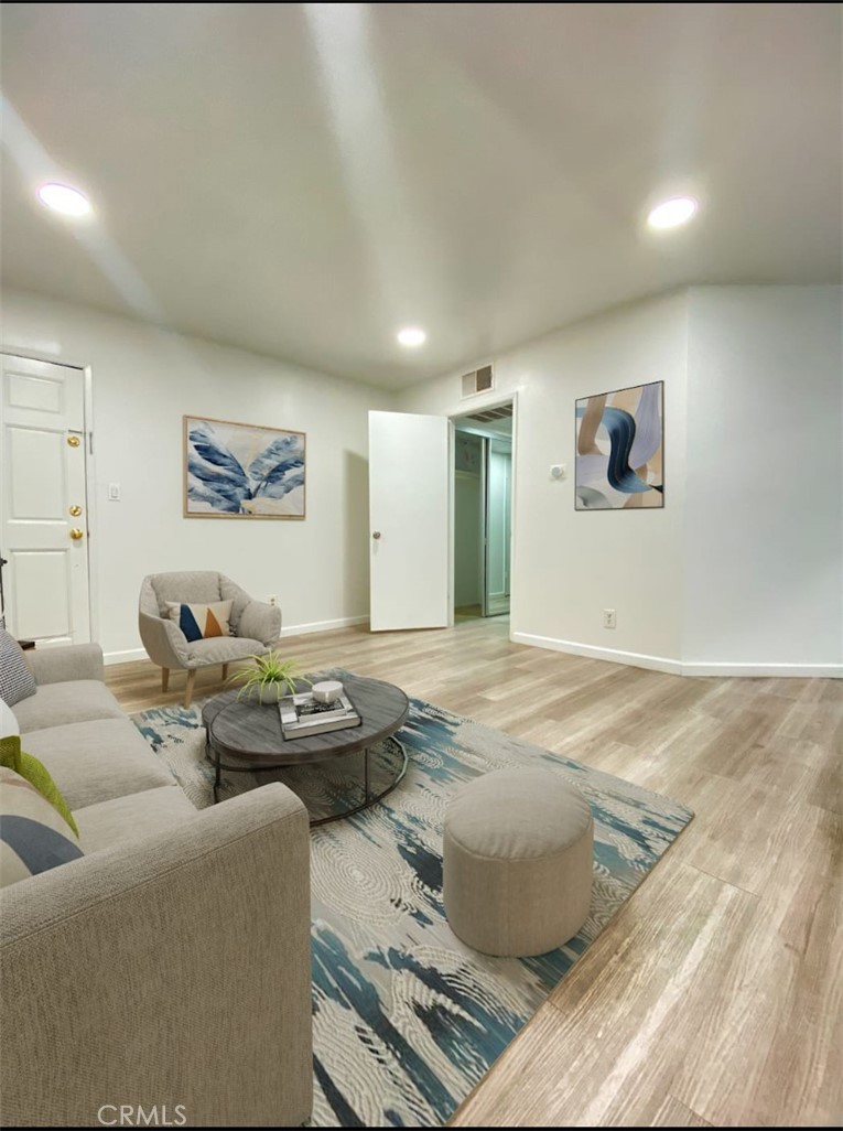18645 Hatteras Street, Unit 278 Tarzana, CA 91356 - Photo 5 of 37 a living room with furniture and window