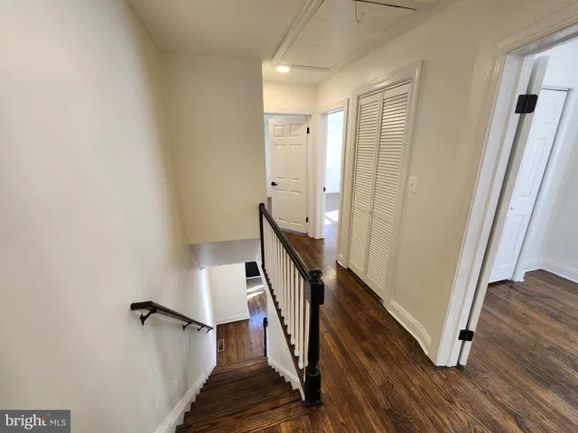 a view of a hallway with staircase