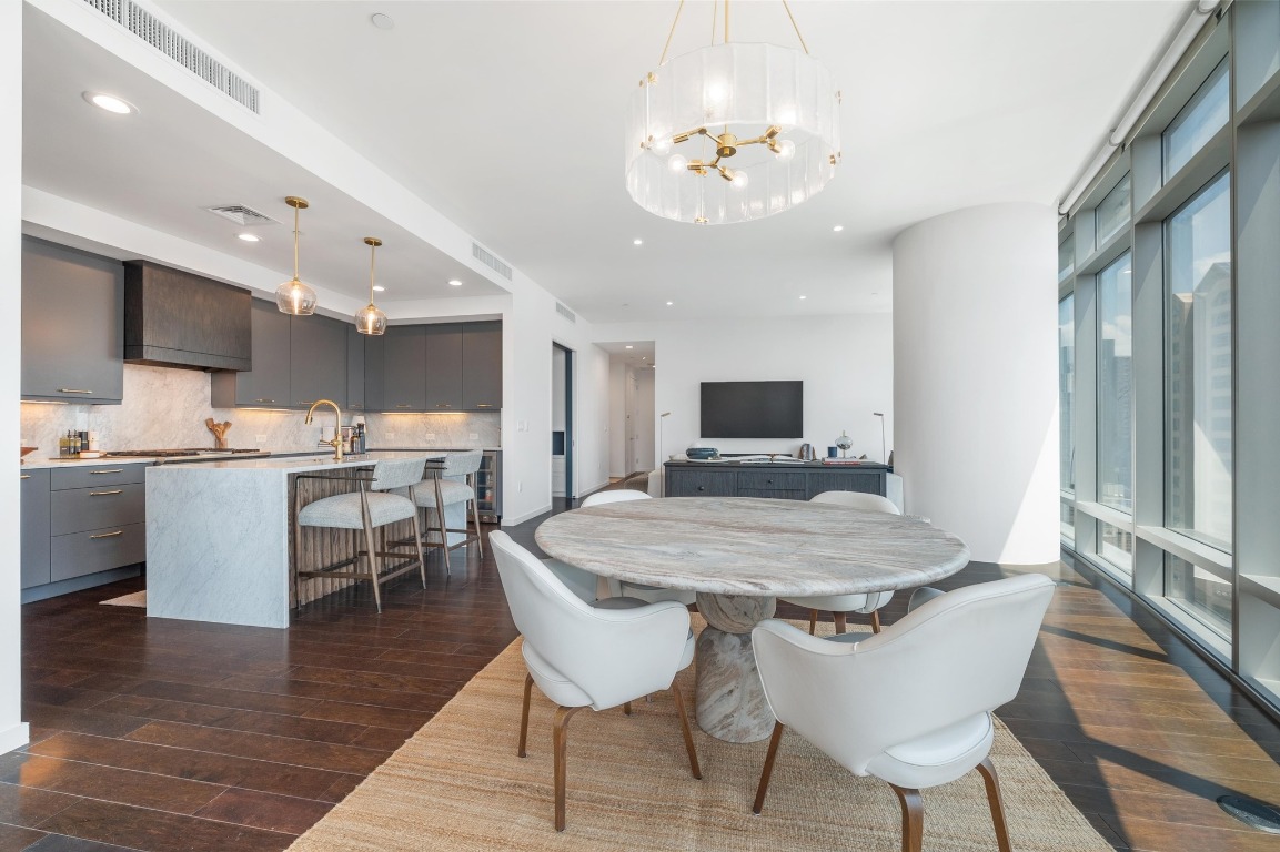 200 Congress Avenue, Unit 19F Austin, TX 78701 - Photo 14 of 40 a view of a dining room with furniture and wooden floor